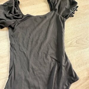 Black body suit with ruffle arm sleeves new.